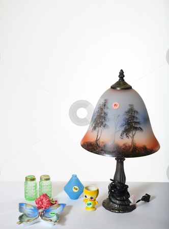 To use this stock image in your creative project, please select the size you need over to the right and click the "Add to Cart" button.
Your downloaded image will come with the Cutcaster watermark removed so don’t worry about the watermark you see on this page. Garage Sale stock photo, Used items displayed for sale at a garage sale. by Brenda Carson