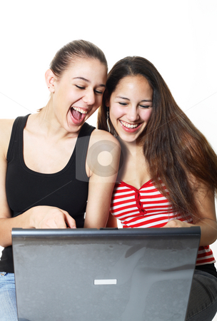 To use this stock image in your creative project, please select the size you need over to the right and click the "Add to Cart" button.
Your downloaded image will come with the Cutcaster watermark removed so don’t worry about the watermark you see on this page. Giggling Teenagers Surf stock photo, Two girls laughing and surfing the internet together. by Brenda Carson