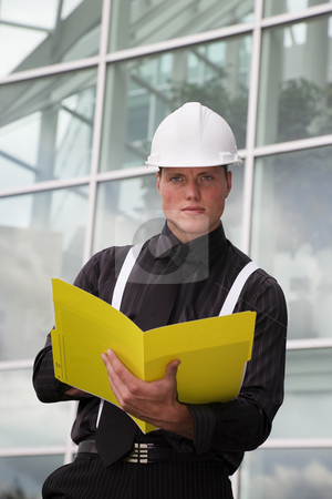 To use this stock image in your creative project, please select the size you need over to the right and click the "Add to Cart" button.
Your downloaded image will come with the Cutcaster watermark removed so don’t worry about the watermark you see on this page. Engineer at Work stock photo, A young engineer going over his notes. by Brenda Carson