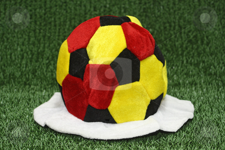 To use this stock image in your creative project, please select the size you need over to the right and click the "Add to Cart" button.
Your downloaded image will come with the Cutcaster watermark removed so don’t worry about the watermark you see on this page. Soccer cap stock photo, Soccer cap in german flag colors on green background by Birgit Reitz-Hofmann