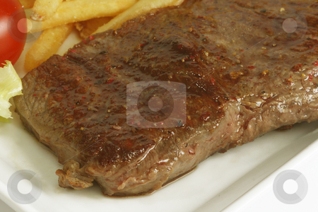 To use this stock image in your creative project, please select the size you need over to the right and click the "Add to Cart" button.
Your downloaded image will come with the Cutcaster watermark removed so don’t worry about the watermark you see on this page. Beef steak stock photo, Grilled beef steak with french fries and sauce served in plate. by Birgit Reitz-Hofmann