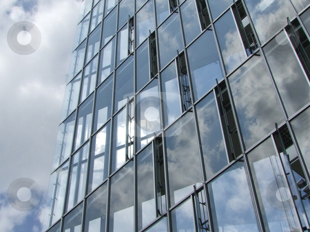 To use this stock image in your creative project, please select the size you need over to the right and click the "Add to Cart" button.
Your downloaded image will come with the Cutcaster watermark removed so don’t worry about the watermark you see on this page. Glass Windows Office Building stock photo, Modern architecture with glass windows by Birgit Reitz-Hofmann