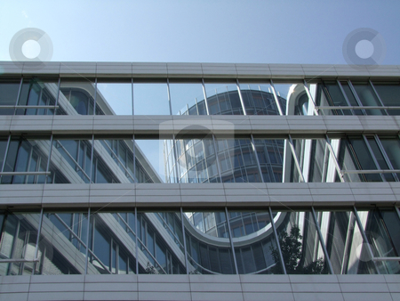 To use this stock image in your creative project, please select the size you need over to the right and click the "Add to Cart" button.
Your downloaded image will come with the Cutcaster watermark removed so don’t worry about the watermark you see on this page. Building reflections stock photo, Modern architecture with glass windows by Birgit Reitz-Hofmann
