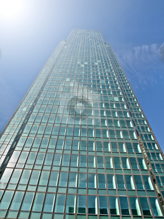 To use this stock image in your creative project, please select the size you need over to the right and click the "Add to Cart" button.
Your downloaded image will come with the Cutcaster watermark removed so don’t worry about the watermark you see on this page. Skycraper and sunlight stock photo, Modern glass skycraper with sunlight by Laurent Dambies