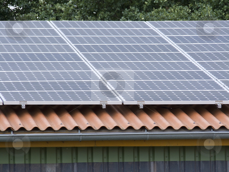 To use this stock image in your creative project, please select the size you need over to the right and click the "Add to Cart" button.
Your downloaded image will come with the Cutcaster watermark removed so don’t worry about the watermark you see on this page. Solar Panel stock photo, Solar panels on a roof by Birgit Reitz-Hofmann