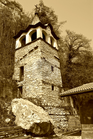 To use this stock image in your creative project, please select the size you need over to the right and click the "Add to Cart" button.
Your downloaded image will come with the Cutcaster watermark removed so don’t worry about the watermark you see on this page. Church and clock tower stock photo, Preobrajenski Monastery near Veliko Turnovo Bulgaria (built in 14th century - collapsed through the ottoman - rebuilt in 19th century) by Desislava Dimitrova