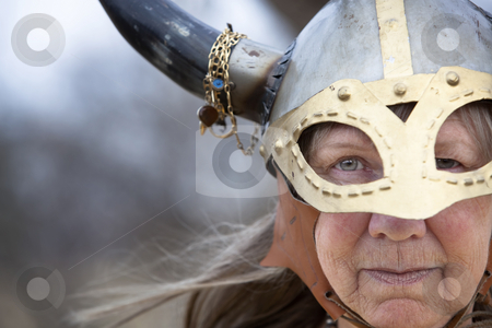 To use this stock image in your creative project, please select the size you need over to the right and click the "Add to Cart" button.
Your downloaded image will come with the Cutcaster watermark removed so don’t worry about the watermark you see on this page. Viking Woman stock photo, Closeup portrait of Viking woman in helmet with horns by Scott Griessel