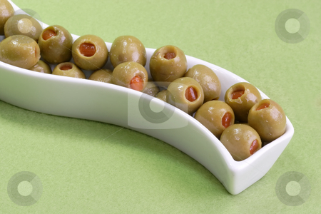 To use this stock image in your creative project, please select the size you need over to the right and click the "Add to Cart" button.
Your downloaded image will come with the Cutcaster watermark removed so don’t worry about the watermark you see on this page. Olives stock photo, Green olives on green background by Birgit Reitz-Hofmann
