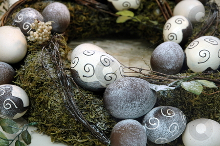 To use this stock image in your creative project, please select the size you need over to the right and click the "Add to Cart" button.
Your downloaded image will come with the Cutcaster watermark removed so don’t worry about the watermark you see on this page. Decorative egg rocks stock photo, Rocks painted with designs and in egg formations by Gary Nicolson