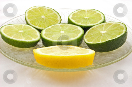 To use this stock image in your creative project, please select the size you need over to the right and click the "Add to Cart" button.
Your downloaded image will come with the Cutcaster watermark removed so don’t worry about the watermark you see on this page. Slices of Fresh Lime and 1 Lemon on Clear Plate stock photo, Slices of fresh green limes and 1 slice of yellow lemon on a clear glass plate, isolated on a white background. by Valerie Garner