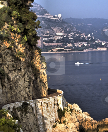 To use this stock image in your creative project, please select the size you need over to the right and click the "Add to Cart" button.
Your downloaded image will come with the Cutcaster watermark removed so don’t worry about the watermark you see on this page. Lower Corniche Road on French Riviera stock photo, The lower cornich road with Monaco in background. by GB Tittle