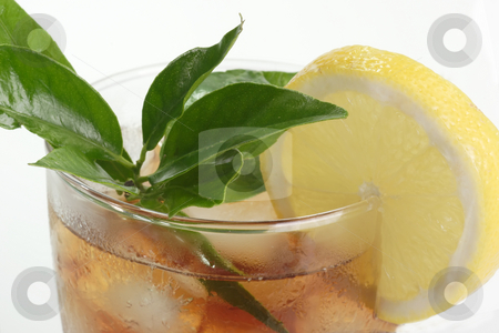 To use this stock image in your creative project, please select the size you need over to the right and click the "Add to Cart" button.
Your downloaded image will come with the Cutcaster watermark removed so don’t worry about the watermark you see on this page. Lemon ice tea stock photo, A glass full of Ice Tea with a lemon slice on bright background by Birgit Reitz-Hofmann