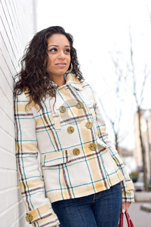 To use this stock image in your creative project, please select the size you need over to the right and click the "Add to Cart" button.
Your downloaded image will come with the Cutcaster watermark removed so don’t worry about the watermark you see on this page. Young Indian Woman stock photo, A young Indian woman posing outdoors in an urban setting. by Todd Arena