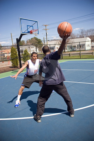 To use this stock image in your creative project, please select the size you need over to the right and click the "Add to Cart" button.
Your downloaded image will come with the Cutcaster watermark removed so don’t worry about the watermark you see on this page. Man Playing Basketball stock photo, A young basketball player is taunting his opponent with the ball while playing one on one. by Todd Arena