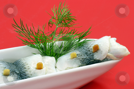 To use this stock image in your creative project, please select the size you need over to the right and click the "Add to Cart" button.
Your downloaded image will come with the Cutcaster watermark removed so don’t worry about the watermark you see on this page. Rolled herring stock photo, Rolled herring in a bowl on red background by Birgit Reitz-Hofmann