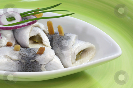 To use this stock image in your creative project, please select the size you need over to the right and click the "Add to Cart" button.
Your downloaded image will come with the Cutcaster watermark removed so don’t worry about the watermark you see on this page. Rolled herring stock photo, Rolled herring in a bowl on green background by Birgit Reitz-Hofmann
