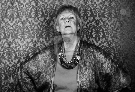 To use this stock image in your creative project, please select the size you need over to the right and click the "Add to Cart" button.
Your downloaded image will come with the Cutcaster watermark removed so don’t worry about the watermark you see on this page. Snooty Senior Woman stock photo, Portrait of snooty senior woman in front of gold background by Scott Griessel