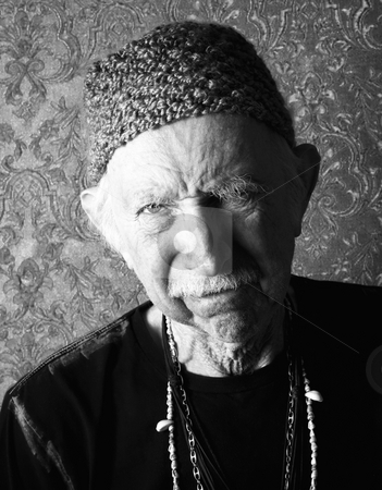 To use this stock image in your creative project, please select the size you need over to the right and click the "Add to Cart" button.
Your downloaded image will come with the Cutcaster watermark removed so don’t worry about the watermark you see on this page. Aging Tough Guy stock photo, Senior tough guy in green knit cap leaning by Scott Griessel