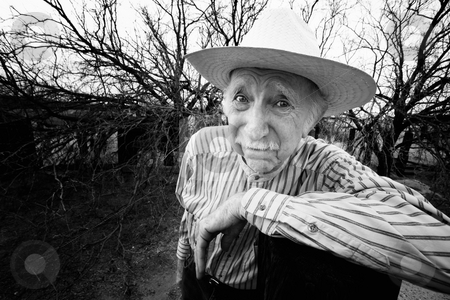 To use this stock image in your creative project, please select the size you need over to the right and click the "Add to Cart" button.
Your downloaded image will come with the Cutcaster watermark removed so don’t worry about the watermark you see on this page. Rancher with sad eyes stock photo, Elderly rancher with sad eyes in a straw hat by Scott Griessel
