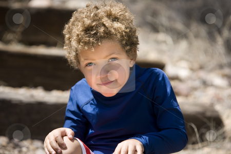 To use this stock image in your creative project, please select the size you need over to the right and click the "Add to Cart" button.
Your downloaded image will come with the Cutcaster watermark removed so don’t worry about the watermark you see on this page. Cute young boy stock photo, Portrait of cute boy with curly hair outdoors by Scott Griessel