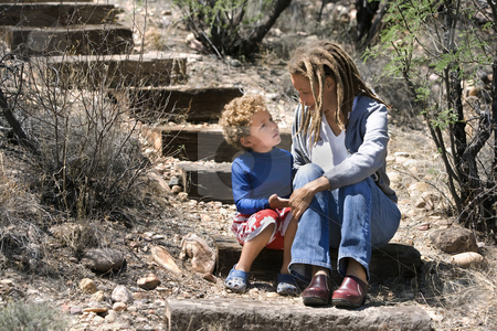 To use this stock image in your creative project, please select the size you need over to the right and click the "Add to Cart" button.
Your downloaded image will come with the Cutcaster watermark removed so don’t worry about the watermark you see on this page. African American Mother and Son stock photo, Portrait of mother with cute son outdoors by Scott Griessel