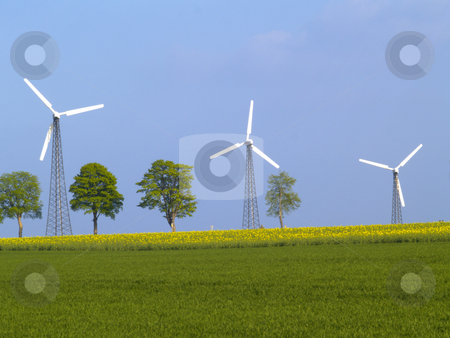 To use this stock image in your creative project, please select the size you need over to the right and click the "Add to Cart" button.
Your downloaded image will come with the Cutcaster watermark removed so don’t worry about the watermark you see on this page. Three wind power plants stock photo, Three wind power plants on nice spring day by Torsten Lorenz