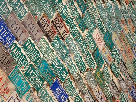 To use this stock image in your creative project, please select the size you need over to the right and click the "Add to Cart" button.
Your downloaded image will come with the Cutcaster watermark removed so don’t worry about the watermark you see on this page. Wall full of License Plates stock photo, A wall is covered with colorful license plates. by Ben O'Neal