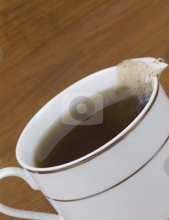 To use this stock image in your creative project, please select the size you need over to the right and click the "Add to Cart" button.
Your downloaded image will come with the Cutcaster watermark removed so don’t worry about the watermark you see on this page. Close up cup of tea stock photo, Close up cup fo tea on a wooden background by John Teeter