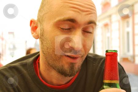 To use this stock image in your creative project, please select the size you need over to the right and click the "Add to Cart" button.
Your downloaded image will come with the Cutcaster watermark removed so don’t worry about the watermark you see on this page. Drunk stock photo, Young man drinking from a bottle of beer by Tudor Antonel adrian