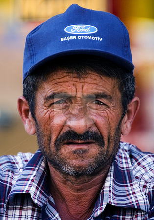 To use this stock image in your creative project, please select the size you need over to the right and click the "Add to Cart" button.
Your downloaded image will come with the Cutcaster watermark removed so don’t worry about the watermark you see on this page. Turkish man stock photo, Portrait of turkish man by Kobby Dagan