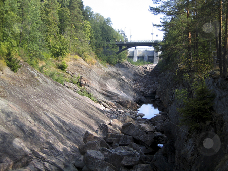 To use this stock image in your creative project, please select the size you need over to the right and click the "Add to Cart" button.
Your downloaded image will come with the Cutcaster watermark removed so don’t worry about the watermark you see on this page. Dry river stock photo, Dry river near Imatra dam, Finland by Alessandro Rizzolli