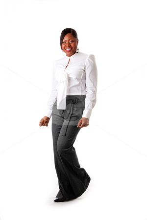 To use this stock image in your creative project, please select the size you need over to the right and click the "Add to Cart" button.
Your downloaded image will come with the Cutcaster watermark removed so don’t worry about the watermark you see on this page. Happy African business woman stock photo, Beautiful African American business woman with attitude dressed in a white shirt and gray pants standing, dancing happy, isolated by Paul Hakimata