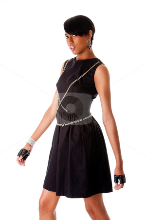 To use this stock image in your creative project, please select the size you need over to the right and click the "Add to Cart" button.
Your downloaded image will come with the Cutcaster watermark removed so don’t worry about the watermark you see on this page. African fashion model stock photo, Beautiful modern classy African American female fashion model in black dress with silver chains and black biker gloves walking, isolated by Paul Hakimata