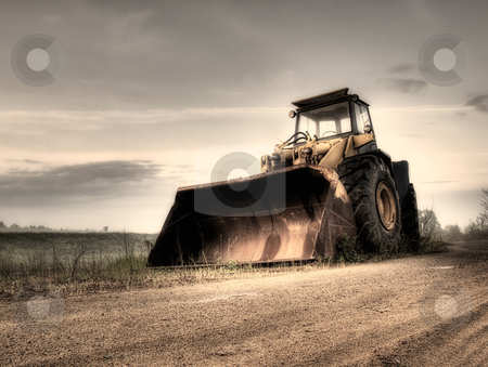 To use this stock image in your creative project, please select the size you need over to the right and click the "Add to Cart" button.
Your downloaded image will come with the Cutcaster watermark removed so don’t worry about the watermark you see on this page. Bulldozer stock photo, Big bulldozer at the building site.Monochrome toned. by Sinisa Botas