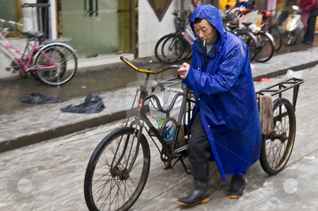 To use this stock image in your creative project, please select the size you need over to the right and click the "Add to Cart" button.
Your downloaded image will come with the Cutcaster watermark removed so don’t worry about the watermark you see on this page. Chinese traffic stock photo, Chinese street in shanghai in snowy day by Kobby Dagan