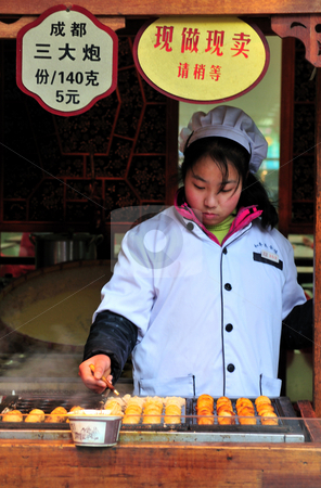 To use this stock image in your creative project, please select the size you need over to the right and click the "Add to Cart" button.
Your downloaded image will come with the Cutcaster watermark removed so don’t worry about the watermark you see on this page. Chinese food seller stock photo, Chinese food seller in the street of Shanghai China by Kobby Dagan