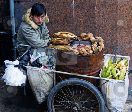 To use this stock image in your creative project, please select the size you need over to the right and click the "Add to Cart" button.
Your downloaded image will come with the Cutcaster watermark removed so don’t worry about the watermark you see on this page. Chinese food seller stock photo, Chinese food seller in the street of Shanghai China by Kobby Dagan