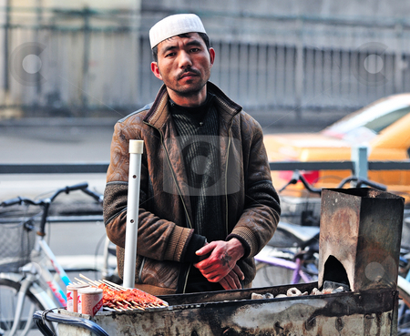 To use this stock image in your creative project, please select the size you need over to the right and click the "Add to Cart" button.
Your downloaded image will come with the Cutcaster watermark removed so don’t worry about the watermark you see on this page. Chinese food seller stock photo, Chinese food seller in the street of Shanghai China by Kobby Dagan