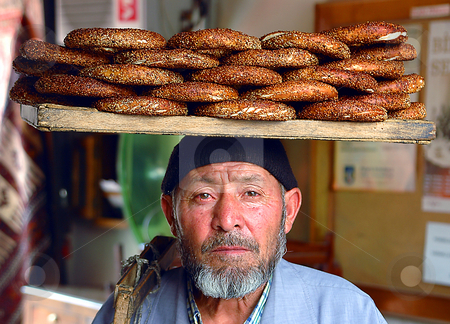 To use this stock image in your creative project, please select the size you need over to the right and click the "Add to Cart" button.
Your downloaded image will come with the Cutcaster watermark removed so don’t worry about the watermark you see on this page. Bagel seller stock photo, Bagel seller in the streets of Ankara by Kobby Dagan