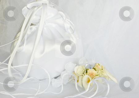 To use this stock image in your creative project, please select the size you need over to the right and click the "Add to Cart" button.
Your downloaded image will come with the Cutcaster watermark removed so don’t worry about the watermark you see on this page. Wedding flowers and bridal bag over veil stock photo, Bridal bag wedding flowers decorations over bridal veil by Desislava Dimitrova