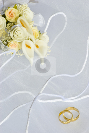 To use this stock image in your creative project, please select the size you need over to the right and click the "Add to Cart" button.
Your downloaded image will come with the Cutcaster watermark removed so don’t worry about the watermark you see on this page. Wedding rings and flowers over veil stock photo, Wedding rings and flowers decorations over bridal veil by Desislava Dimitrova