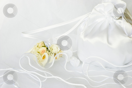 To use this stock image in your creative project, please select the size you need over to the right and click the "Add to Cart" button.
Your downloaded image will come with the Cutcaster watermark removed so don’t worry about the watermark you see on this page. Wedding flowers and bridal bag over veil stock photo, Bridal bag wedding flowers decorations over bridal veil by Desislava Dimitrova