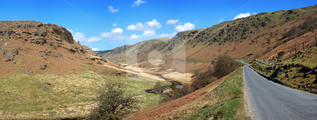 To use this stock image in your creative project, please select the size you need over to the right and click the "Add to Cart" button.
Your downloaded image will come with the Cutcaster watermark removed so don’t worry about the watermark you see on this page. Panoramic narrow country road through the hills to Tregaron in Wales, UK. stock photo, Panoramic narrow country road through the hills to Tregaron in Wales, UK. by Stephen Rees