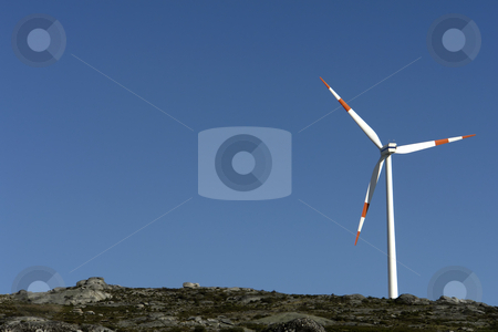 To use this stock image in your creative project, please select the size you need over to the right and click the "Add to Cart" button.
Your downloaded image will come with the Cutcaster watermark removed so don’t worry about the watermark you see on this page. Turbine stock photo, White wind turbine in the top of the mountain by Rui Vale de Sousa