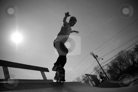 To use this stock image in your creative project, please select the size you need over to the right and click the "Add to Cart" button.
Your downloaded image will come with the Cutcaster watermark removed so don’t worry about the watermark you see on this page. Skateboarder On The Ramp stock photo, Portrait of a young skateboarder skating on a ramp at the skate park. by Todd Arena