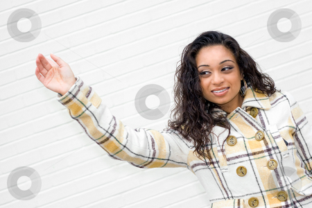 To use this stock image in your creative project, please select the size you need over to the right and click the "Add to Cart" button.
Your downloaded image will come with the Cutcaster watermark removed so don’t worry about the watermark you see on this page. Hailing a Taxi Cab stock photo, A portrait of an attractive young Indian woman waving to some friends or even hailing a taxi cab. by Todd Arena