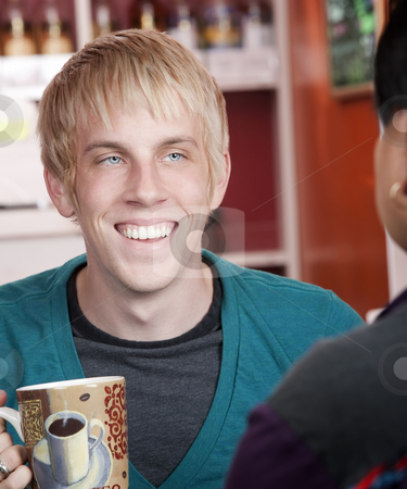 To use this stock image in your creative project, please select the size you need over to the right and click the "Add to Cart" button.
Your downloaded image will come with the Cutcaster watermark removed so don’t worry about the watermark you see on this page. Man in coffee house with male friend stock photo, Handsome young man in coffee house with male friend by Scott Griessel