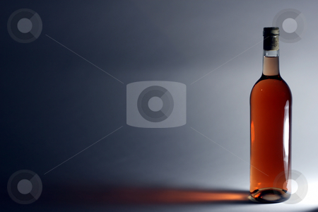 To use this stock image in your creative project, please select the size you need over to the right and click the "Add to Cart" button.
Your downloaded image will come with the Cutcaster watermark removed so don’t worry about the watermark you see on this page. Ros? wine stock photo, A single bottle of Ros? wine in front of a light source by Jan Martin Will
