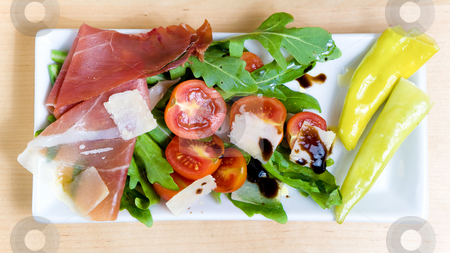 To use this stock image in your creative project, please select the size you need over to the right and click the "Add to Cart" button.
Your downloaded image will come with the Cutcaster watermark removed so don’t worry about the watermark you see on this page. Antipasto stock photo, Antipasto served on a plate with salad, cheese and tomatoes by Jan Martin Will
