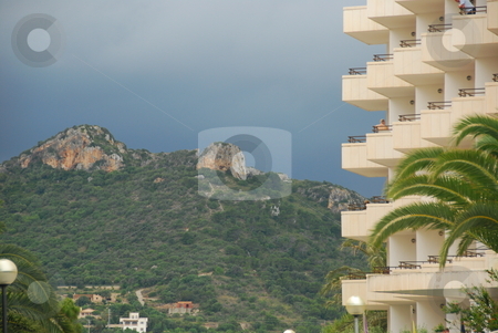 To use this stock image in your creative project, please select the size you need over to the right and click the "Add to Cart" button.
Your downloaded image will come with the Cutcaster watermark removed so don’t worry about the watermark you see on this page. Apartment building on the island mallorca stock photo, Apartment building with palm trees and mountains in the background by Wolfgang Zintl